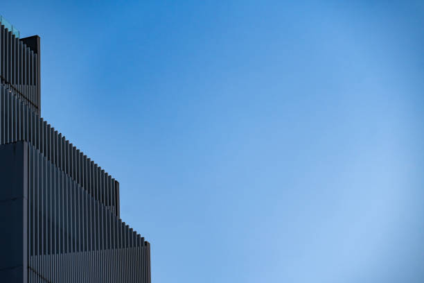 Abstract pattern, facade of a minimalist business building, leaving space for text.