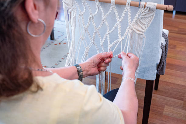 istock A 60+ Woman Weaving Macrame, Thriving in Her New Hobby and Active Lifestyle 2153672724