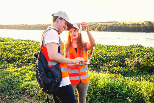 istock Two researcher beside a lake 2153673217