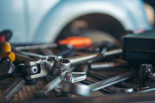 istock Mechanic tools engineering equipment car auto repair shop with copy space. Blurred background mechanical service. Heavy screw grungy rusted wrenches dirty screwdriver object. Industrial hardware set 2153676928