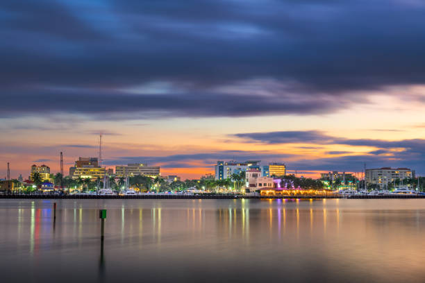Bradenton, Florida, USA downtown cityscape on the Manatee River at dusk.