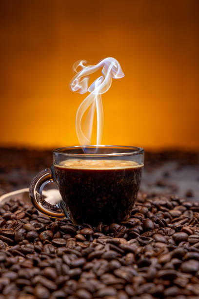 Captivating Caffeine: Stunning Studio Shot of Coffee Beans and coffee cup