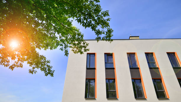 istock Sustainable glass office building with trees for reducing carbon dioxide. Eco-friendly building in modern city. 2153687642