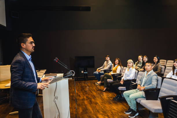 istock Male CEO having speech on press conference in convention center. 2153690363