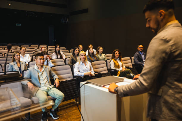 istock Male CEO having speech on press conference in convention center. 2153690406