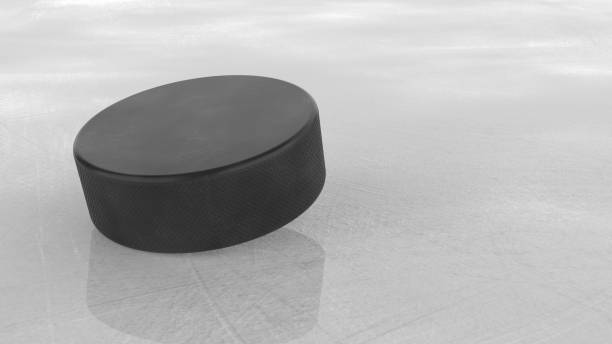 istock Hockey puck on ice background. 3D illustration 2153691073