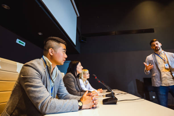 istock Male CEO having speech on press conference in convention center. 2153691294