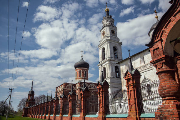 View of russian architecture, ancient church architectural complex, white clouds in the sky. Volokolamsk, Russia