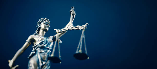 istock Lady Justice statue in law on blue background 2153699902