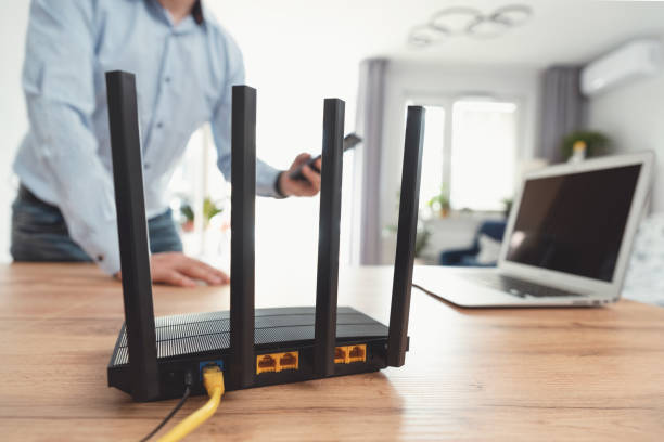 istock Modern wi-fi router on light table in room 2153699999