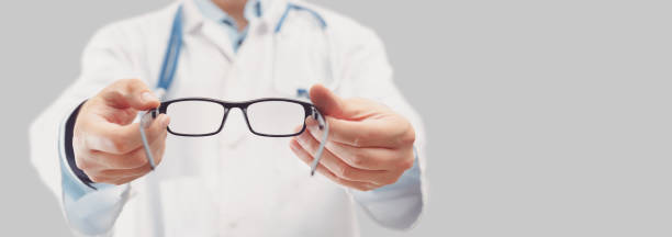Optician helping client with new eyeglasses