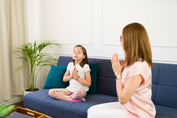 istock Experienced child psychologist teaches some breathing exercises to calm down during a therapy session 2153706301