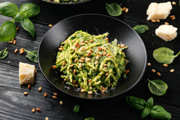 istock Trofie pasta with creamy spinach sauce and toasted pine nuts 2153707258