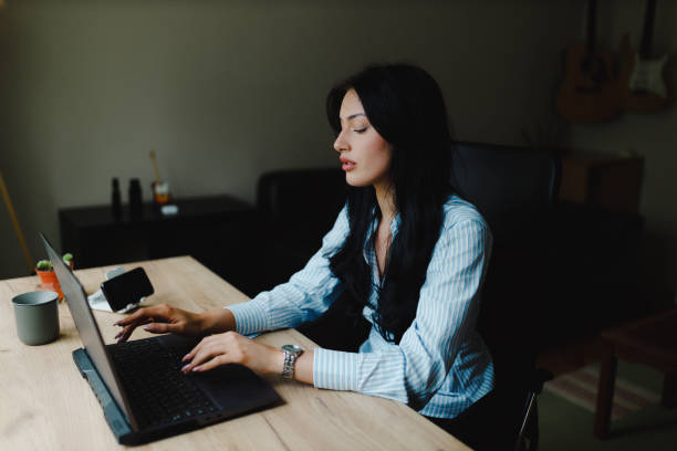 istock Businesswoman using a laptop and working from home 2153707912