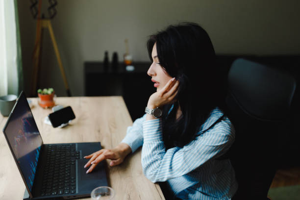 istock A young woman using a laptop in the home office 2153708528