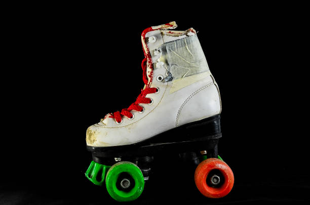 istock A white and red roller skate with green wheels 2153708612