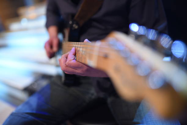 istock Electric guitar player on a stage 2153709184