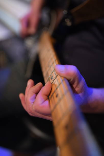 istock Electric guitar player on a stage 2153709189
