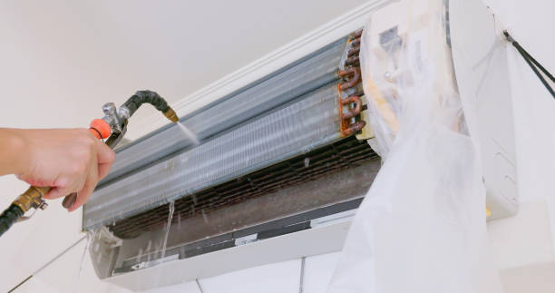 istock cleaner washing air conditioner 2153709195