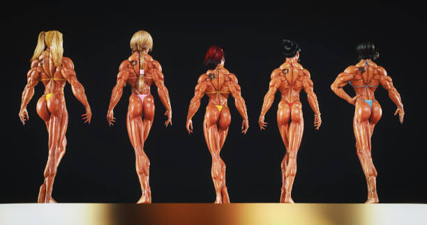 istock Female Bodybuilders Posing on Stage 2153709203