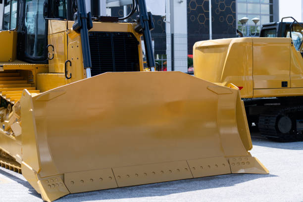 Fleet of yellow construction machines.