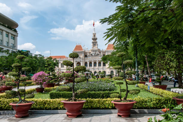 Ho Chi Minh City, Saigon, Vietnam - nov 17, 2013: view of garden dedicated to Ho Chi Minh, leader of the Vietnamese war of independence, in front of the  City Hall of Ho Chi Minh City