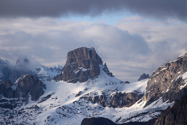 detail of mountain top in the Italian Dolomites with snow and clouds. Vaneto, Italy