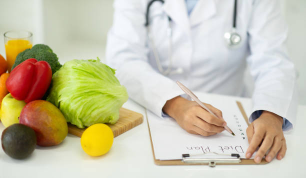 istock Cropped of woman dietitian working on diet plan. 2153720748