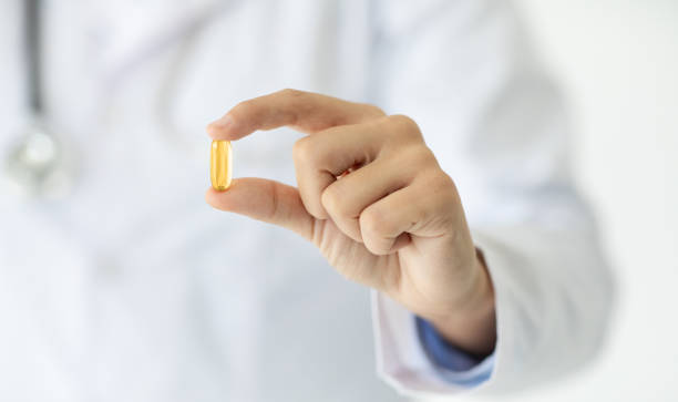 istock Doctor hand holding pill capsule supplement, cropped 2153720822