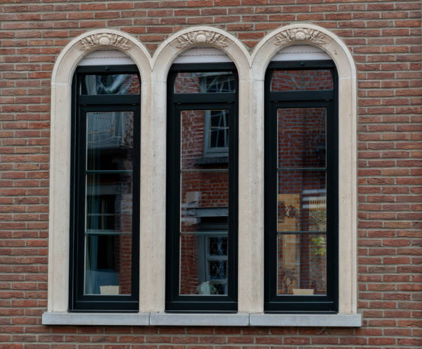 istock Gothic style arched window,brick wall with windows, windows on the red wall, windows on red brick in an abandoned building 2153726959