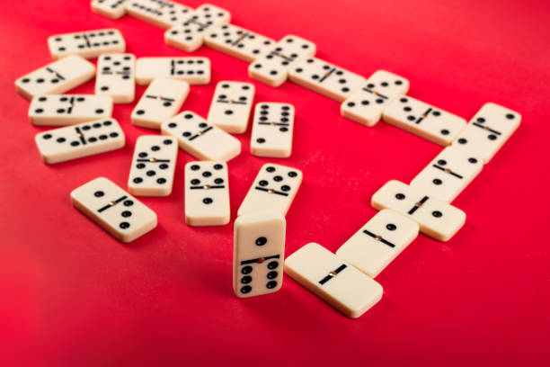 istock Dominoes on a red background. 2153728936