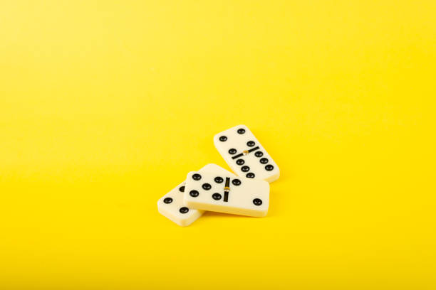 istock Dominoes on a yellow background. 2153729057