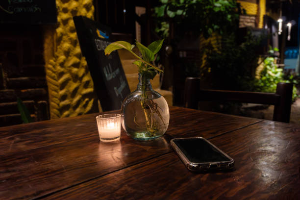 istock Intimate restaurant table with candle and smartphone 2153729133