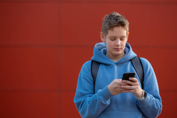 istock Digital Communication: Teen Boy Sending Message 2153731980