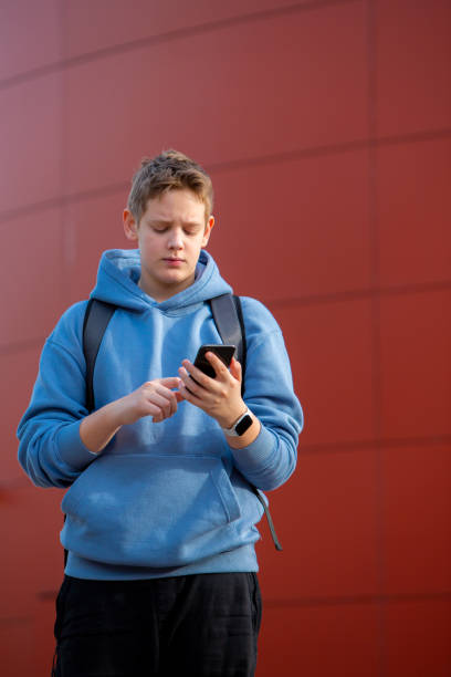 istock Focused E-Learning: Teen Boy Engrossed in Typing 2153732179