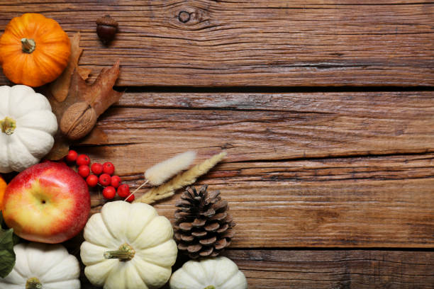 istock Thanksgiving day. Flat lay composition with pumpkins on wooden table, space for text 2153733166