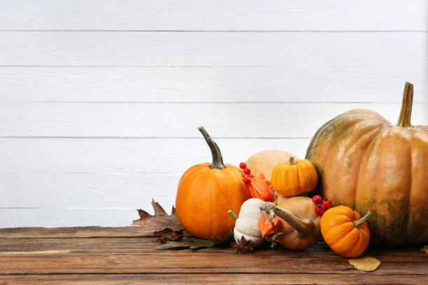 istock Happy Thanksgiving day. Beautiful composition with pumpkins on wooden table, space for text 2153733214