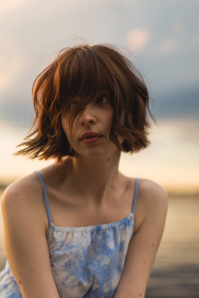 istock Young woman enjoying sunset. 2153737065