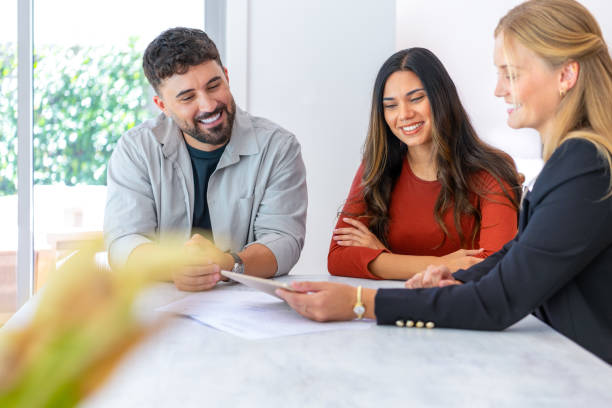 istock Insurance, finance or real estate agent with couple looking through documents. 2153738285