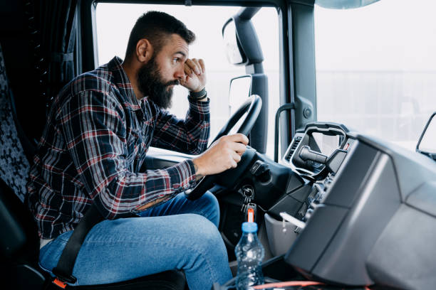 istock Truck driver holding steering wheel 2153739130