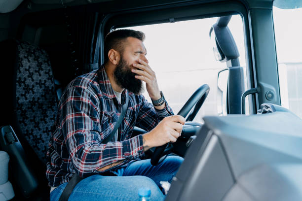 istock The tired truck driver yawns 2153739139
