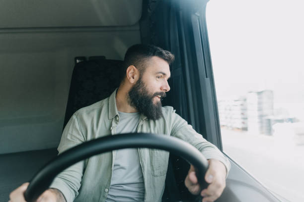 istock Bearded truck driver looking out window 2153739150