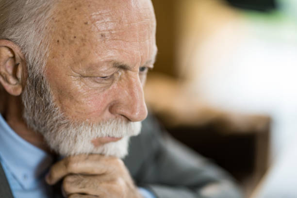 istock Serious senior businessman working on something and contemplating. 2153739584