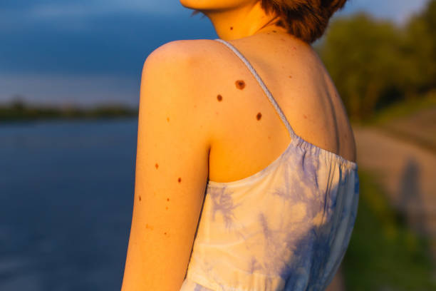 Fashion model at sunset background.