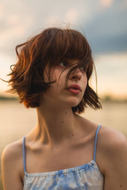 istock Young woman enjoying sunset. 2153741099