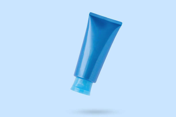 Blank blue cosmetic tube mockup isolated on blue background