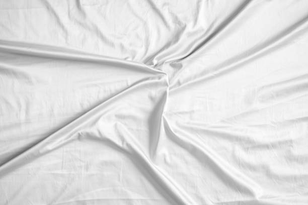 istock Abstract white wrinkled bedding sheet fabric texture background 2153741242
