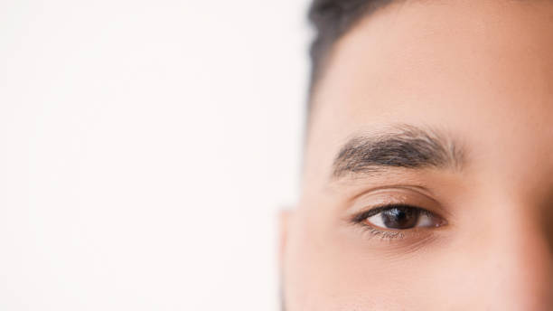 istock Eye care vision correction man half face look 2153741305