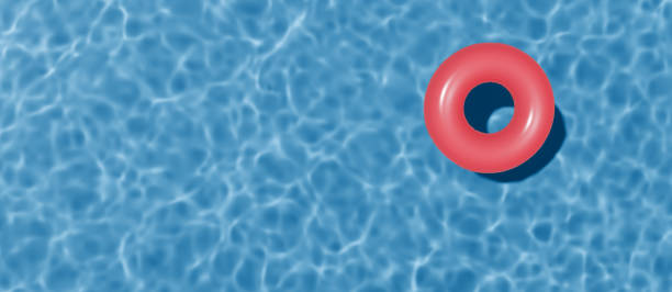 istock Summer banner with copy space. Swimming pool top view. Red swimming ring in the empty clear pool. 2153741568