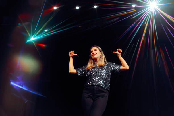 istock Entertainer Pointing to Herself Feeling Confident on Stage 2153745654